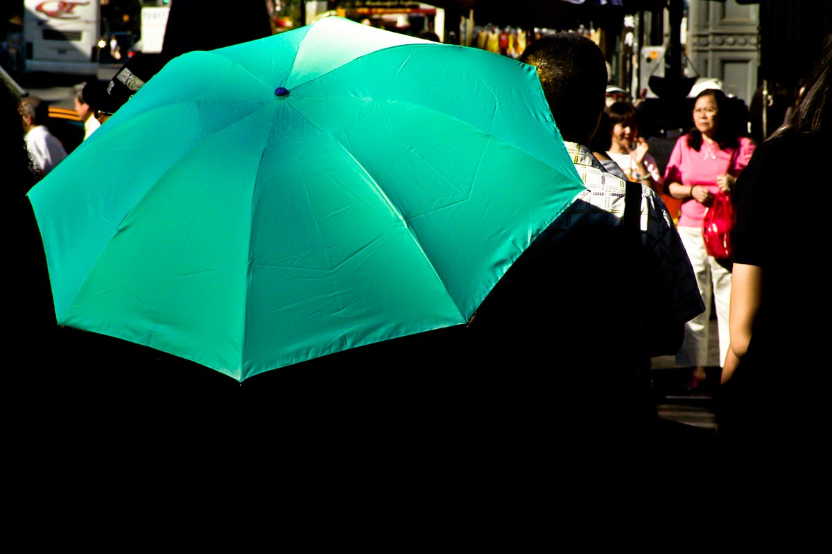 asian street scene with person carrying umbrella